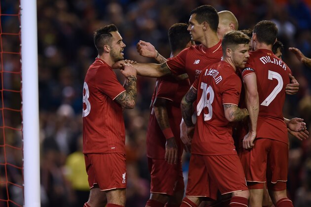 Liverpool's English striker Danny Ings (L) celebrates with teammates after scoring the opening goal of the English League Cup third round football match between Liverpool and Carlisle United at Anfield in Liverpool, north west England on September 23, 2015. AFP PHOTO / PAUL ELLIS

RESTRICTED TO EDITORIAL USE. No use with unauthorized audio, video, data, fixture lists, club/league logos or 'live' services. Online in-match use limited to 75 images, no video emulation. No use in betting, games or single club/league/player publications.        (Photo credit should read PAUL ELLIS/AFP/Getty Images)