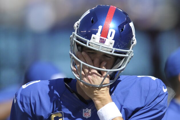 New York Giants quarterback Eli Manning reacts prior to an NFL football game against the Atlanta Falcons, Sunday, Sept. 20, 2015, in East Rutherford, N.J. (AP Photo/Bill Kostroun)