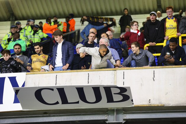 LONDON, ENGLAND - SEPTEMBER 23:  Arsenal fans remove hoardings after their victory in the Capital One Cup third round match between Tottenham Hotspur and Arsenal at White Hart Lane on September 23, 2015 in London, England.  (Photo by Ian Walton/Getty Images)