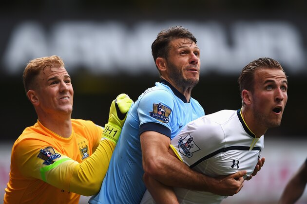 LONDON, ENGLAND - MAY 03:  Joe Hart (L) of Manchester City comes to claim the ball under pressure from Harry Kane (R) of Tottenham Hotspur with Martin Demichelis of Manchester City during the Barclays Premier League match between Tottenham Hotspur and Manchester City at White Hart Lane on May 3, 2015 in London, England.  (Photo by Shaun Botterill/Getty Images)