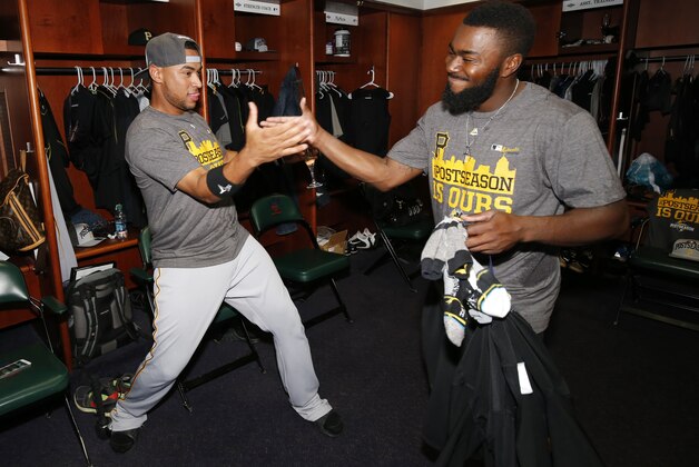 Pittsburgh Pirates' Josh Harrison, right, and Elias Diaz celebrate after the Pirates' 13-7 win over the Colorado Rockies in a baseball game clinched a playoff berth, Wednesday, Sept. 23, 2015, in Denver. (AP Photo/Jack Dempsey) Pittsburgh Pirates' Josh Harrison, right, and Elias Diaz celebrate after the Pirates' 13-7 win over the Colorado Rockies in a baseball game clinched a playoff berth, Wednesday, Sept. 23, 2015, in Denver. (AP Photo/Jack Dempsey)