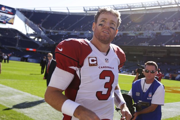 Arizona Cardinals quarterback Carson Palmer (3) runs off the field after an NFL football game against the Chicago Bears, Sunday, Sept. 20, 2015, in Chicago. The Cardinals won 48-23. (AP Photo/Michael Conroy)