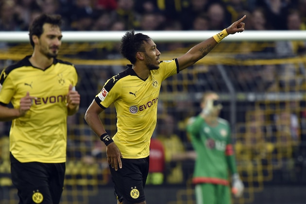 Dortmund's Pierre-Emerick Aubameyang celebrates after scoring during the German Bundesliga soccer match between Borussia Dortmund and Bayer Leverkusen in Dortmund, Germany, Sunday, Sept. 20, 2015. Dortmund defeated Leverkusen with 3-0. (AP Photo/Martin Meissner)