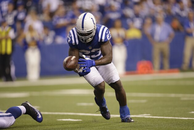 Indianapolis Colts running back Frank Gore (23) fumbles the ball during the second half of an NFL football game against the New York Jets in Indianapolis, Monday, Sept. 21, 2015. (AP Photo/AJ Mast)