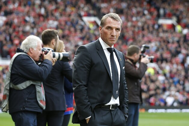 Liverpool manager Brendan Rodgers stands on the touchline before the English Premier League soccer match between Manchester United and Liverpool at Old Trafford Stadium, Manchester, England, Saturday, Sept. 12, 2015. (AP Photo/Jon Super)