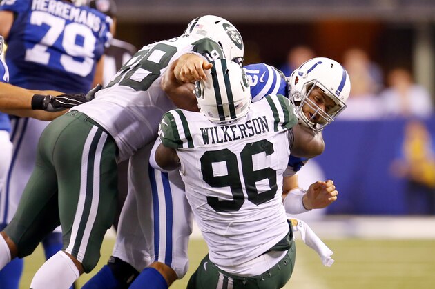 New York Jets defensive end Muhammad Wilkerson (96) an outside linebacker Quinton Coples (98) bring down Indianapolis Colts quarterback Andrew Luck (12) during an NFL football game in Indianapolis, Monday, Sept. 21, 2015. (Jeff Haynes/AP Images for Panini) New York Jets defensive end Muhammad Wilkerson (96) an outside linebacker Quinton Coples (98) bring down Indianapolis Colts quarterback Andrew Luck (12) during an NFL football game in Indianapolis, Monday, Sept. 21, 2015. (Jeff Haynes/AP Images for Panini)
