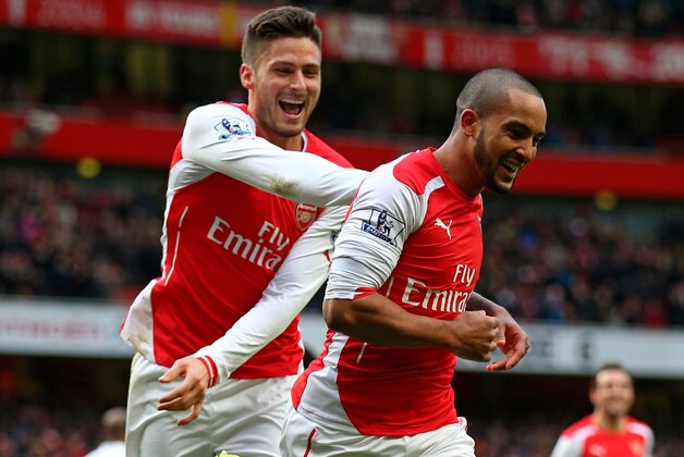 LONDON, ENGLAND - FEBRUARY 01:  Theo Walcott (R) of Arsenal is congratulated by teammate Olivier Giroud of Arsenal after scoring his team's third goal during the Barclays Premier League match between Arsenal and Aston Villa at the Emirates Stadium on February 1, 2015 in London, England.  (Photo by Paul Gilham/Getty Images)