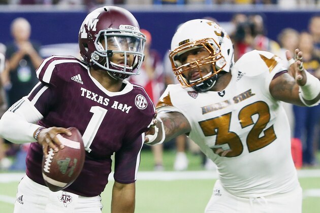HOUSTON, TX - SEPTEMBER 05:  Kyler Murray #1 of the Texas A&M Aggies runs upfield past Antonio Longino #32 of the Arizona State Sun Devils during the second half of their game during the Advocare Texas Kickoff at NRG Stadium on September 5, 2015 in Houston, Texas.  (Photo by Scott Halleran/Getty Images)