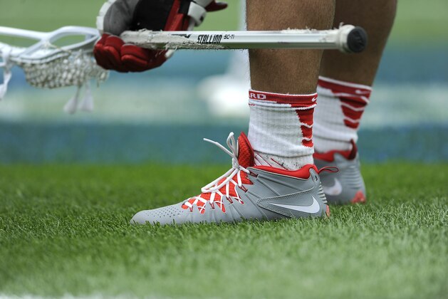 Nike sneakers are shown during an NCAA division 1 semifinal lacrosse game between Duke and Cornell on Saturday, May 25, 2013, in Philadelphia. (AP Photo/Michael Perez)