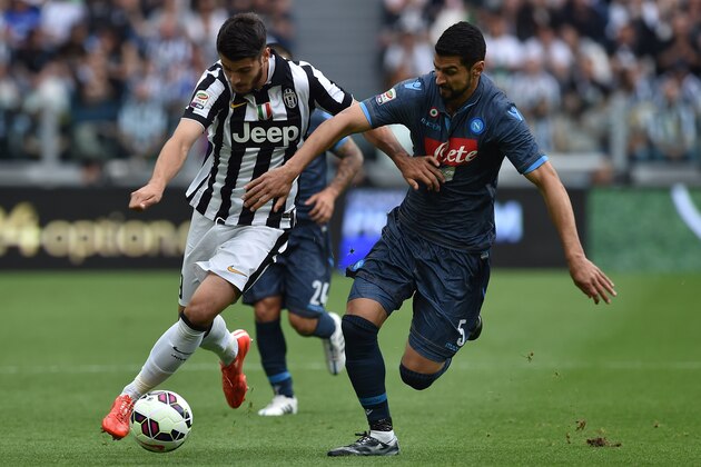 TURIN, ITALY - MAY 23:  Alvaro Morata (L) of Juventus FC is challenged by Miguel Angel Britos of SSC Napoli during the Serie A match between Juventus FC and SSC Napoli at Juventus Arena on May 23, 2015 in Turin, Italy.  (Photo by Valerio Pennicino/Getty Images)