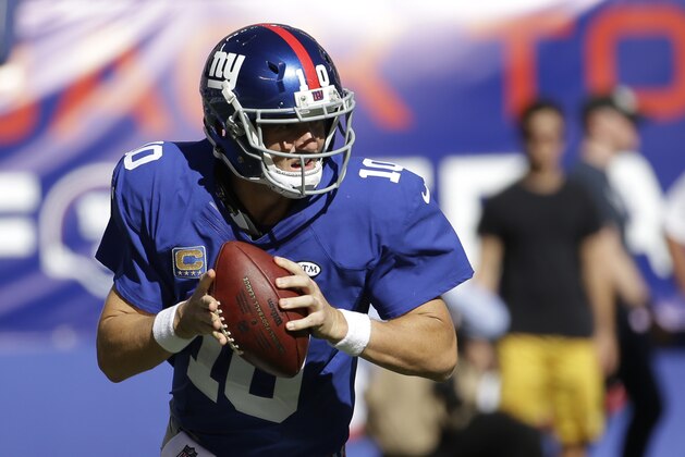 New York Giants quarterback Eli Manning looks to pass against the Atlanta Falcons during the second half of an NFL football game, Sunday, Sept. 20, 2015, in East Rutherford, N.J. (AP Photo/Seth Wenig)