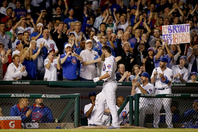 Chicago Cubs' Kris Bryant, takes the curtain call after hitting a two-run home run off Milwaukee Brewers starting pitcher Tyler Cravy, also scoring Kyle Schwarber, during the third inning of a baseball game Tuesday, Sept. 22, 2015, in Chicago. (AP Photo/Charles Rex Arbogast)