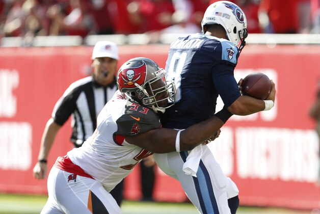Tennessee Titans quarterback Marcus Mariota (8) is sacked by Tampa Bay Buccaneers defensive tackle Gerald McCoy (93) during the first half of an NFL football game, Sunday, Sept. 13, 2015, in Tampa, Fla. (AP Photo/Scott Audette)