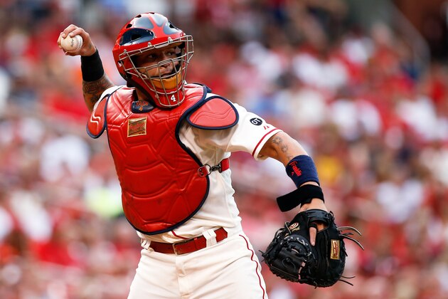 St. Louis Cardinals catcher Yadier Molina throws to second base during a baseball game against the Colorado Rockies Saturday, Aug. 1, 2015, in St. Louis. (AP Photo/Scott Kane)
