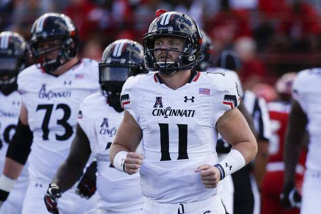 Cincinnati quarterback Gunner Kiel (11) runs back to the sideline in the first half of an NCAA college football game against Miami of Ohio at Yager Stadium, Saturday, Sept. 19, 2015, in Oxford, Ohio. Cincinnati won 37-33. (AP Photo/John Minchillo)