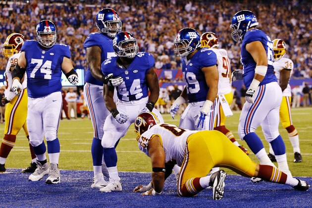 EAST RUTHERFORD, NJ - SEPTEMBER 24:  Andre Williams #44 of the New York Giants celebrates his first quarter touchdown against the Washington Redskins at MetLife Stadium on September 24, 2015 in East Rutherford, New Jersey.  (Photo by Al Bello/Getty Images)