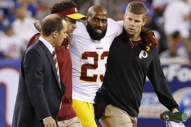 Washington Redskins cornerback DeAngelo Hall (23) is helped off the field during the second half an NFL football game against the New York Giants Thursday, Sept. 24, 2015, in East Rutherford, N.J. (AP Photo/Kathy Willens)