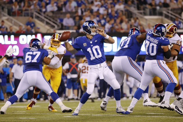 New York Giants quarterback Eli Manning (10) throws a pass  during the first half an NFL football game against the Washington Redskins Thursday, Sept. 24, 2015, in East Rutherford, N.J. (AP Photo/Kathy Willens)