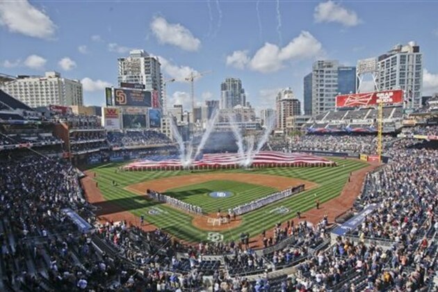 FILE - In this April 1, 2014, file photo, Opening Day celebrations take place at Petco Park before the San Diego Padres and Los Angeles Dodgers play a baseball game in San Diego. San Diego’s Petco Park will host baseball’s All-Star game in 2016, marking the second straight year the game will be played at a National League site.  (AP Photo/Lenny Ignelzi, File)