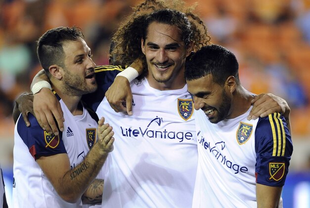 Real Salt Lake forward Devon Sandoval, center, celebrates his goal with teammates Juan Manuel Martinez, left, and Javier Morales during the second half of an MLS soccer game against the Houston Dynamo, Saturday, Sept. 12, 2015, in Houston. Real Salt Lake won 3-1. (AP Photo/Eric Christian Smith) Real Salt Lake forward Devon Sandoval, center, celebrates his goal with teammates Juan Manuel Martinez, left, and Javier Morales during the second half of an MLS soccer game against the Houston Dynamo, Saturday, Sept. 12, 2015, in Houston. Real Salt Lake won 3-1. (AP Photo/Eric Christian Smith)