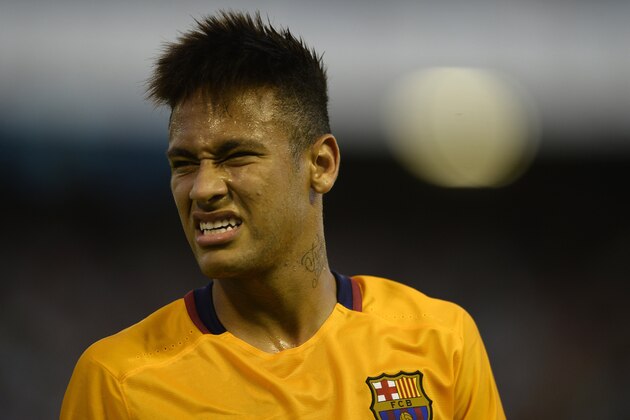 Barcelona's Brazilian forward Neymar grimaces during the Spanish league football match Celta Vigo vs FC Barcelona at the Balaidos stadium in Vigo on September 23, 2015.  AFP PHOTO / MIGUEL RIOPA        (Photo credit should read MIGUEL RIOPA/AFP/Getty Images)