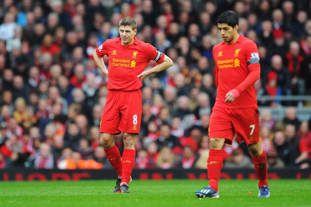 LIVERPOOL, ENGLAND - APRIL 21: Steven Gerrard (L) of Liverpool and team mate Luis Suarez look dejected after the opening goal by Oscar of Chelsea during the Barclays Premier League match between Liverpool and Chelsea at Anfield on April 21, 2013 in Liverpool, England.  (Photo by Michael Regan/Getty Images)