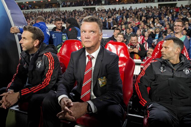Manchester United's coach Louis van Gaal (C) attends  in his dug out during the UEFA Champions League football match between Psv Eindhoven and Manchester United at Philips stadium in Eindhoven, on September 15, 2015. AFP PHOTO / ANP / OLAF KRAAK 

== NETHERLANDS OUT ==        (Photo credit should read OLAF KRAAK/AFP/Getty Images)