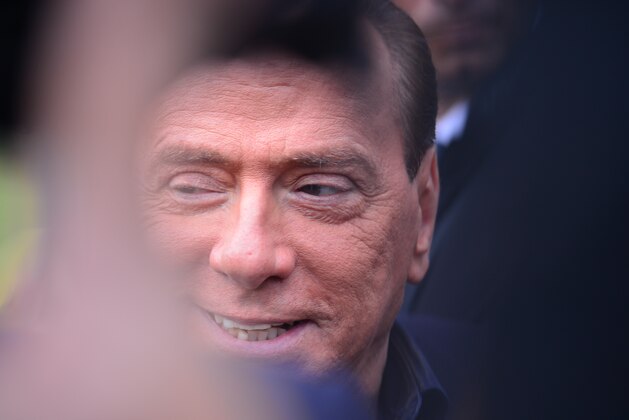 Italian former prime minister and owner of the AC Milan football team, Silvio Berlusconi, arrives at the AC Milan training grounds in Milanello on December 8 , 2012. Prime Minister Mario Monti's government hung by a thread the day before as predecessor Silvio Berlusconi prepared to return to the fray, with his supporters arguing that Italy is now far worse off than before. AFP PHOTO / GIUSEPPE CACACE        (Photo credit should read GIUSEPPE CACACE/AFP/Getty Images)