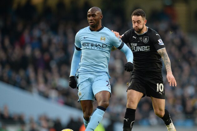 Burnley's English striker Danny Ings (R) vies with Manchester City's French defender Eliaquim Mangala (L) during the English Premier League football match between Manchester City and Burnley at the Etihad Stadium in Manchester, north west England, on December 28, 2014. The game finished 2-2. AFP PHOTO / OLI SCARFF

RESTRICTED TO EDITORIAL USE. No use with unauthorized audio, video, data, fixture lists, club/league logos or live services. Online in-match use limited to 45 images, no video emulation. No use in betting, games or single club/league/player publications.        (Photo credit should read OLI SCARFF/AFP/Getty Images)