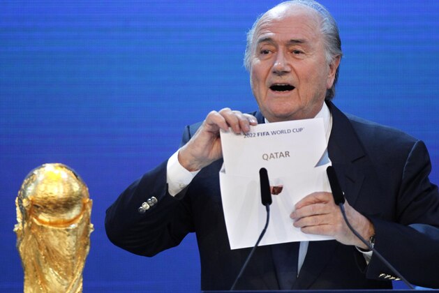 FILE - In this Thursday, Dec.2, 2010 file photo FIFA President Sepp Blatter announces Qatar to host the 2022 soccer World Cup in Zurich, Switzerland. FIFA has cleared Russia and Qatar of any wrongdoing in their winning bids for the next two World Cups. (AP Photo/Michael Probst)