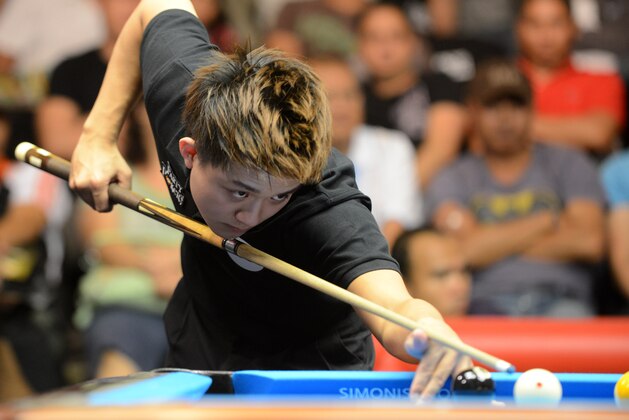 Taiwan's Han En Hsu lines up a shot as he and teammate Hsin Ting Chen (not pictured) compete against Great Britain's Darren Appleton and Chris Melling (not pictured) during the quarterfinals of the 2012 PartyPoker.net World Cup of Pool in Manila on September 8, 2012. Taiwan defeated Great Britain 9-8 and advanced to the semifinal round. AFP PHOTO / JAY DIRECTO (Photo credit should read JAY DIRECTO/AFP/GettyImages) Taiwan's Han En Hsu lines up a shot as he and teammate Hsin Ting Chen (not pictured) compete against Great Britain's Darren Appleton and Chris Melling (not pictured) during the quarterfinals of the 2012 PartyPoker.net World Cup of Pool in Manila on September 8, 2012. Taiwan defeated Great Britain 9-8 and advanced to the semifinal round. AFP PHOTO / JAY DIRECTO (Photo credit should read JAY DIRECTO/AFP/GettyImages)