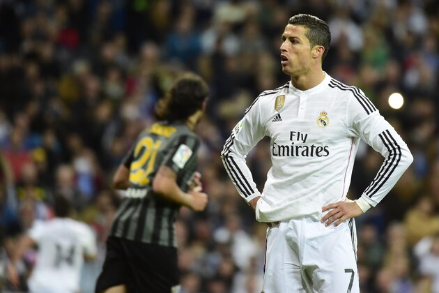 Real Madrid's Portuguese forward Cristiano Ronaldo stands after failing a penalty during the Spanish league football match Real Madrid CF vs Malaga FC at the Santiago Bernabeu stadium in Madrid on April 18, 2015.   AFP PHOTO/ GERARD JULIEN        (Photo credit should read GERARD JULIEN/AFP/Getty Images)