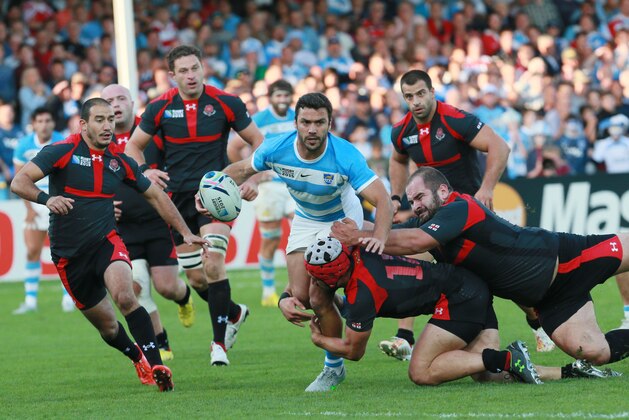 Argentina's Martin Landajo is tackled during the Rugby World Cup Pool C match between Argentina and Georgia at Kingsholm, Gloucester, England, Friday, Sept. 25, 2015. (AP Photo/Martin Cleaver)