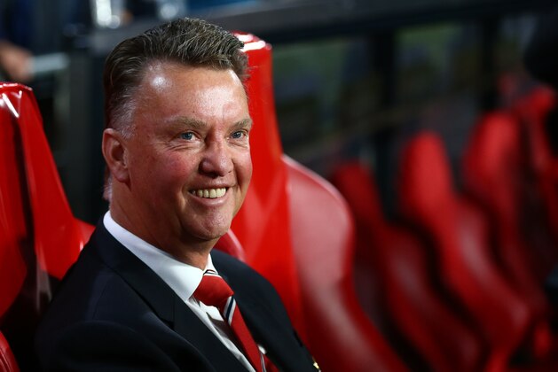 Manchester United's manager Louis van Gaal smiles prior the Champions League Group B soccer match between PSV and Manchester United at Philips stadium in Eindhoven, Netherlands, Tuesday, Sept. 15, 2015. (AP Photo/Peter Dejong)