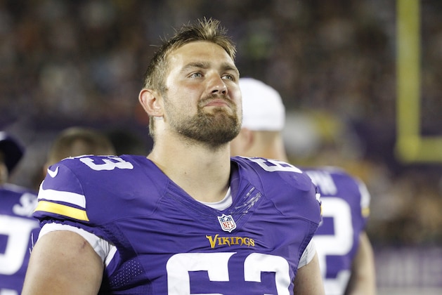 Minnesota Vikings guard Brandon Fusco (63) watches from the sidelines in the second half of a preseason NFL football game against the Tampa Bay Buccaneers at TCF Bank Stadium Saturday, Aug. 15, 2015, in Minneapolis. (AP Photo/Ann Heisenfelt)