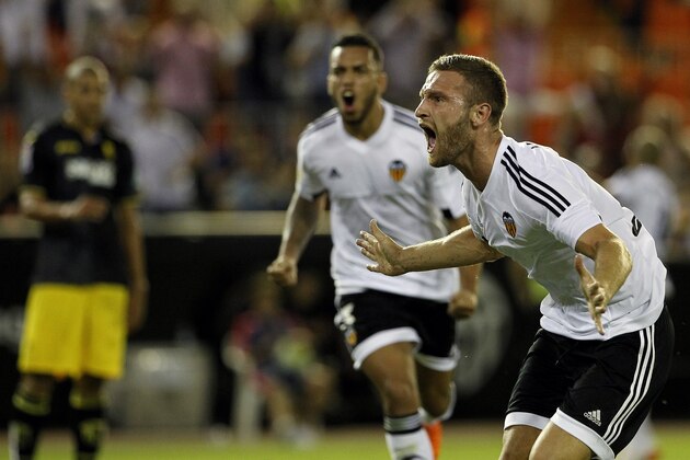 Valencia's German defender Shkodran Mustafi celebrates his goal during the Spanish league football match Valencia CF vs Granada CF at the Mestalla stadium in Valencia on September 25, 2015.  AFP PHOTO / JOSE JORDAN        (Photo credit should read JOSE JORDAN/AFP/Getty Images)