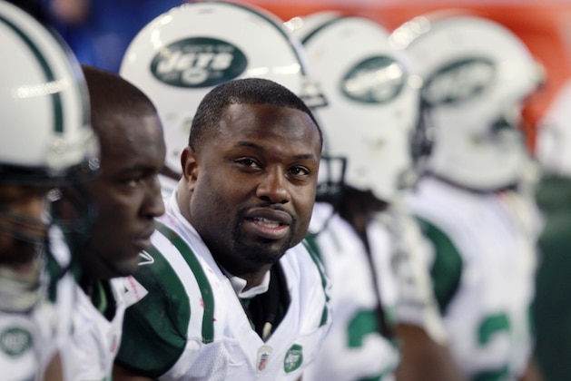New York Jets linebacker Bart Scott sits on the bench in the fourth quarter of an NFL football game against the New England Patriots, Monday, Dec. 6, 2010, in Foxborough, Mass. The Patriots won 45-3. (AP Photo/Michael Dwyer)