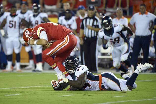 Kansas City Chiefs quarterback Alex Smith (11) is tackled by Denver Broncos linebacker DeMarcus Ware (94) during the first half of an NFL football game in Kansas City, Mo., Thursday, Sept. 17, 2015. (AP Photo/Ed Zurga)