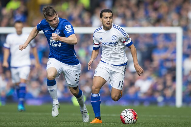 Everton's Seamus Coleman, left, fights for the ball against   Chelsea's Pedro during the English Premier League soccer match between Everton and Chelsea at Goodison Park Stadium, Liverpool, England, Saturday Sept. 12, 2015. (AP Photo/Jon Super)