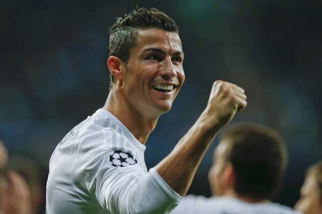 Real Madrid's Cristiano Ronaldo celebrates after scoring  after an hat trick during a Group A Champions League soccer match between Real Madrid and Shakhtar Donetsk at the Santiago Bernabeu stadium in Madrid, Spain, Tuesday, Sept. 15, 2015. (AP Photo/Paul White)