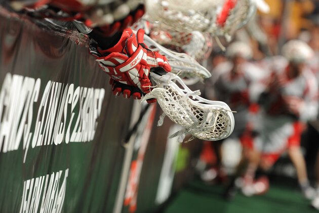 BOSTON - JANUARY 28: The glove and stick of a Boston Blazer hangs over the boards against the Philadelphia Wings at the TD Garden on January 28, 2011 in Boston, Massachusetts.  (Photo by Steve Babineau/Getty Images)