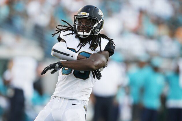 Jacksonville Jaguars free safety Sergio Brown (38) celebrates a sack on Miami Dolphins quarterback Ryan Tannehill (17) during the second half of an NFL football game, Sunday, Sept. 20, 2015, in Jacksonville, Fla. (AP Photo/Stephen B. Morton)