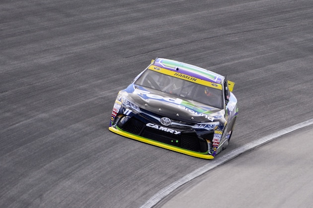 Denny Hamlin drives his car during practice for the NASCAR Sprint Cup Series auto race at Chicagoland Speedway, Saturday, Sept. 19, 2015, in Joliet, Ill. (AP Photo/Matt Marton)