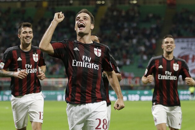 AC Milan's Giacomo Bonaventura celebrates after scoring during the Serie A soccer match between AC Milan and Palermo at the San Siro stadium in Milan, Italy, Saturday, Sept. 19, 2015. (AP Photo/Antonio Calanni)