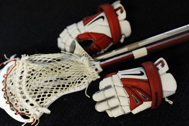A Nike lacrosse glove is shown during an NCAA division 1 semifinal lacrosse game on Saturday, May 25, 2013, in Philadelphia. (AP Photo/Michael Perez)