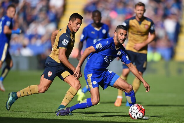 LEICESTER, ENGLAND - SEPTEMBER 26: Riyad Mahrez of Leicester City and Alexis Sanchez of Arsenal compete for the ball during the Barclays Premier League match between Leicester City and Arsenal at The King Power Stadium on September 26, 2015 in Leicester, United Kingdom.  (Photo by Michael Regan/Getty Images)