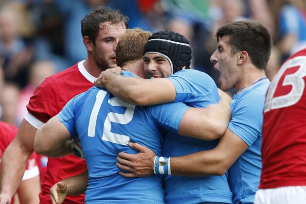 Italy's Gonzalo Garcia, centre left, celebrates scoring a try with teammates during the Rugby World Cup Pool D match between Italy and Canada at Elland Road, Leeds, England, Saturday, Sept. 26, 2015. (AP Photo/Alastair Grant) Italy's Gonzalo Garcia, centre left, celebrates scoring a try with teammates during the Rugby World Cup Pool D match between Italy and Canada at Elland Road, Leeds, England, Saturday, Sept. 26, 2015. (AP Photo/Alastair Grant)
