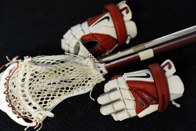 A Nike lacrosse glove is shown during an NCAA division 1 semifinal lacrosse game on Saturday, May 25, 2013, in Philadelphia. (AP Photo/Michael Perez)