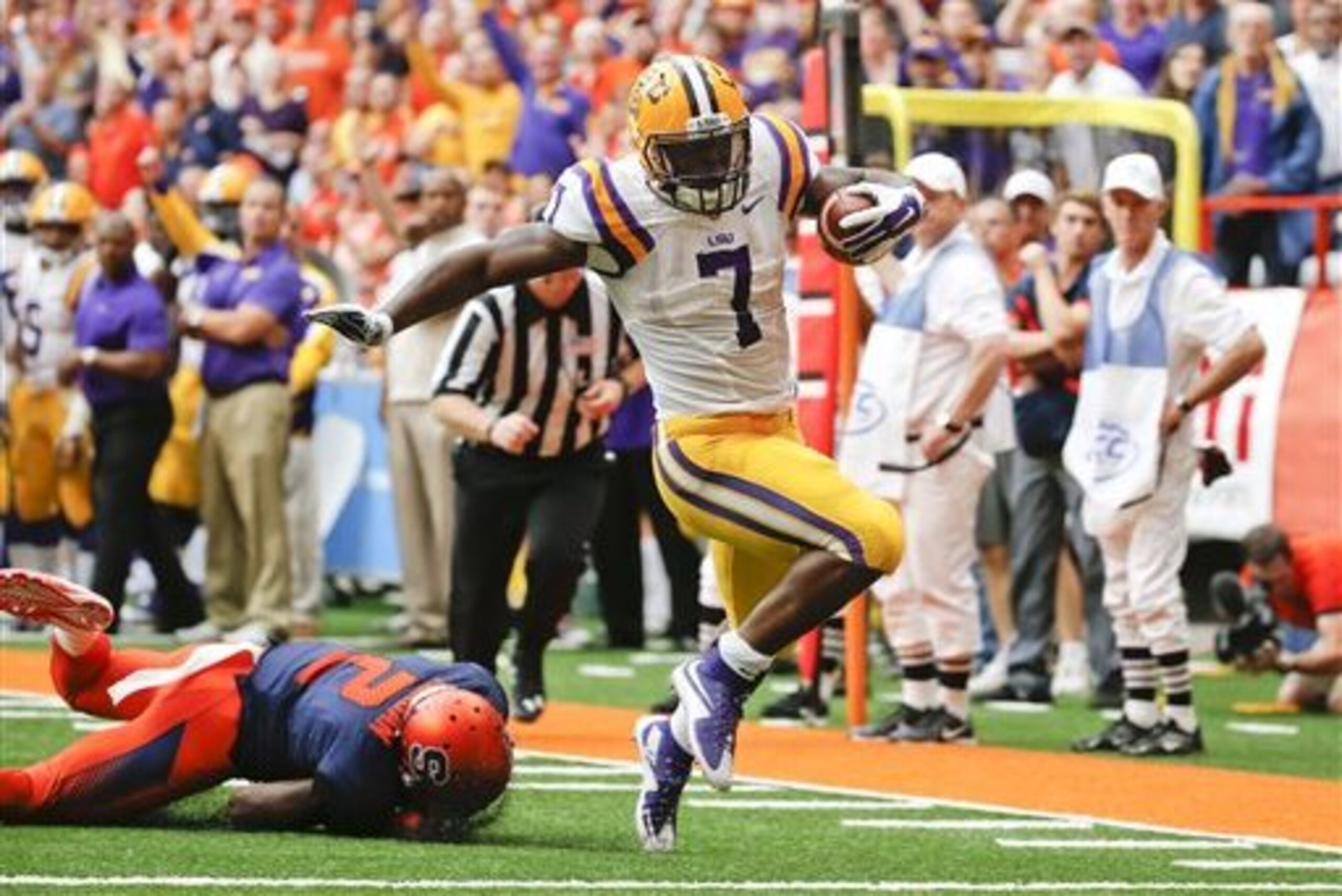 LSU running back Leonard Fournette (7) gets past Syracuse cornerback Wayne Morgan (2) for a touchdown in the first half of an NCAA college football game, Saturday, Sept. 26, 2015, in Syracuse, N.Y. Leonard Fournette ran for a career-high 244 yards and two touchdowns in their 34-24 win. (AP Photo/Mike Groll) LSU running back Leonard Fournette (7) gets past Syracuse cornerback Wayne Morgan (2) for a touchdown in the first half of an NCAA college football game, Saturday, Sept. 26, 2015, in Syracuse, N.Y. Leonard Fournette ran for a career-high 244 yards and two touchdowns in their 34-24 win. (AP Photo/Mike Groll)