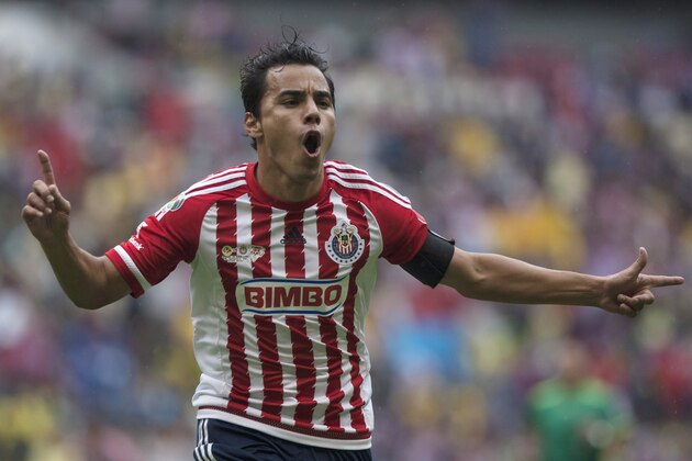 Chivas' Omar Bravo celebrates his goal against America during a Mexican soccer league match in Mexico City, Saturday, Sept. 26, 2015. (AP Photo/Christian Palma)